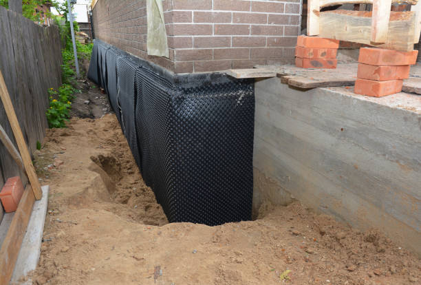 Happy homeowners after waterproofing job in Laceys Spring